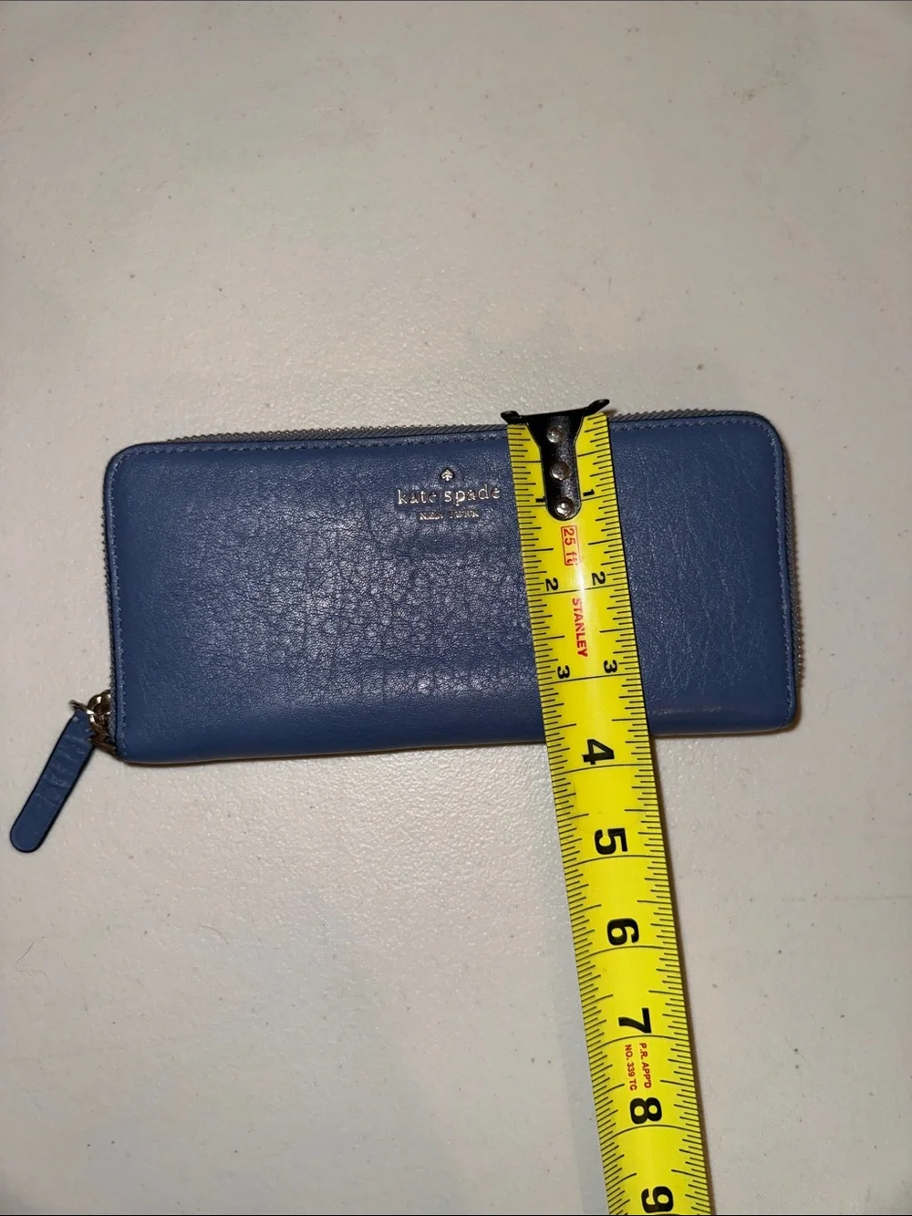 kate spade blue pebbled leather zip-around wallet with wristlet